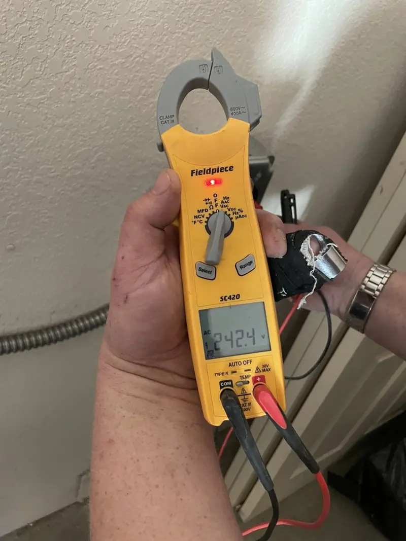 Voltage testing with clamp meter during Ceiling Fan Installation in Lancaster